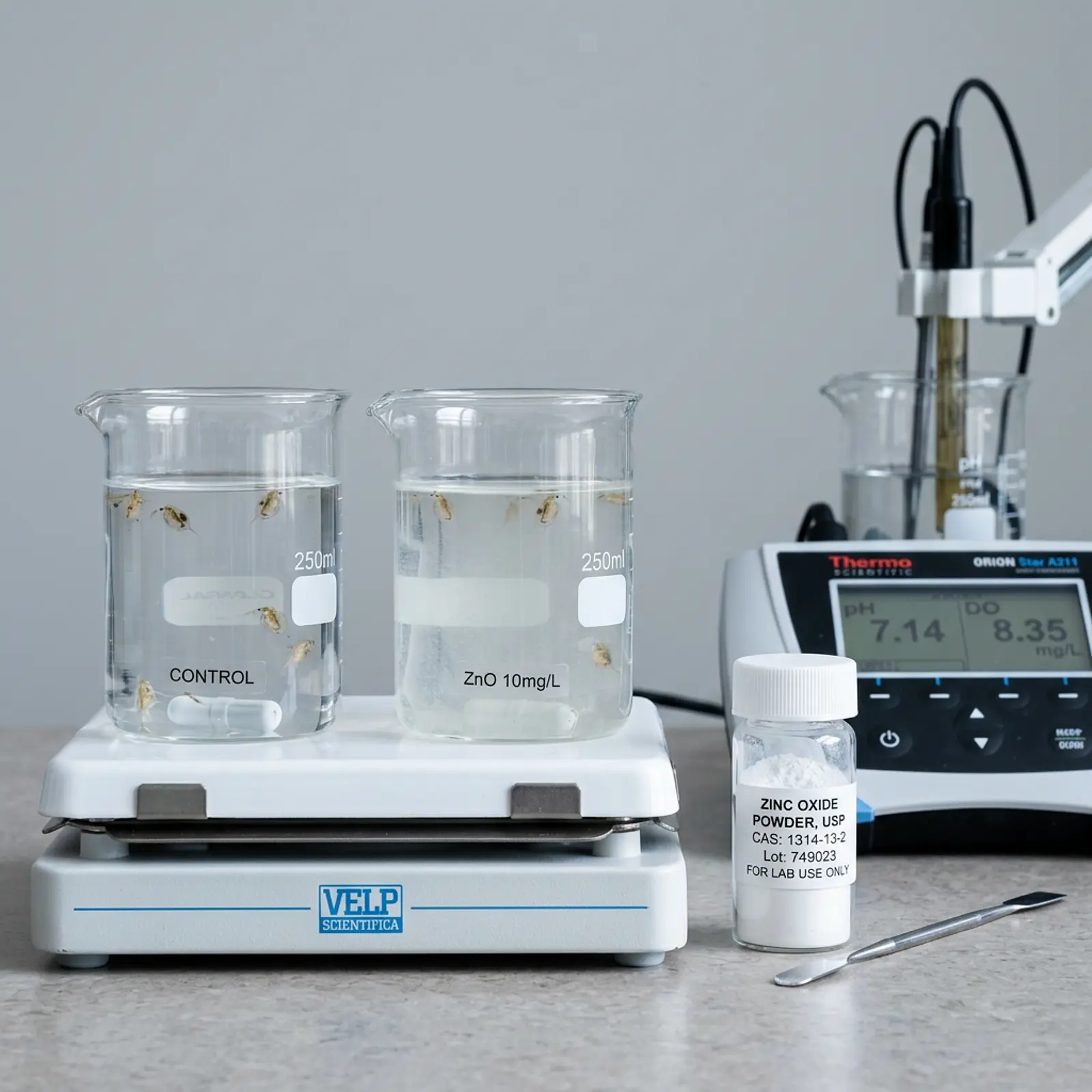 Macro shot of a water-toxicity lab setup: aquarium tank, zinc oxide sample containers